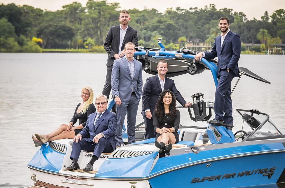 Young & Younger Real Estate Team on a boat in Orlando