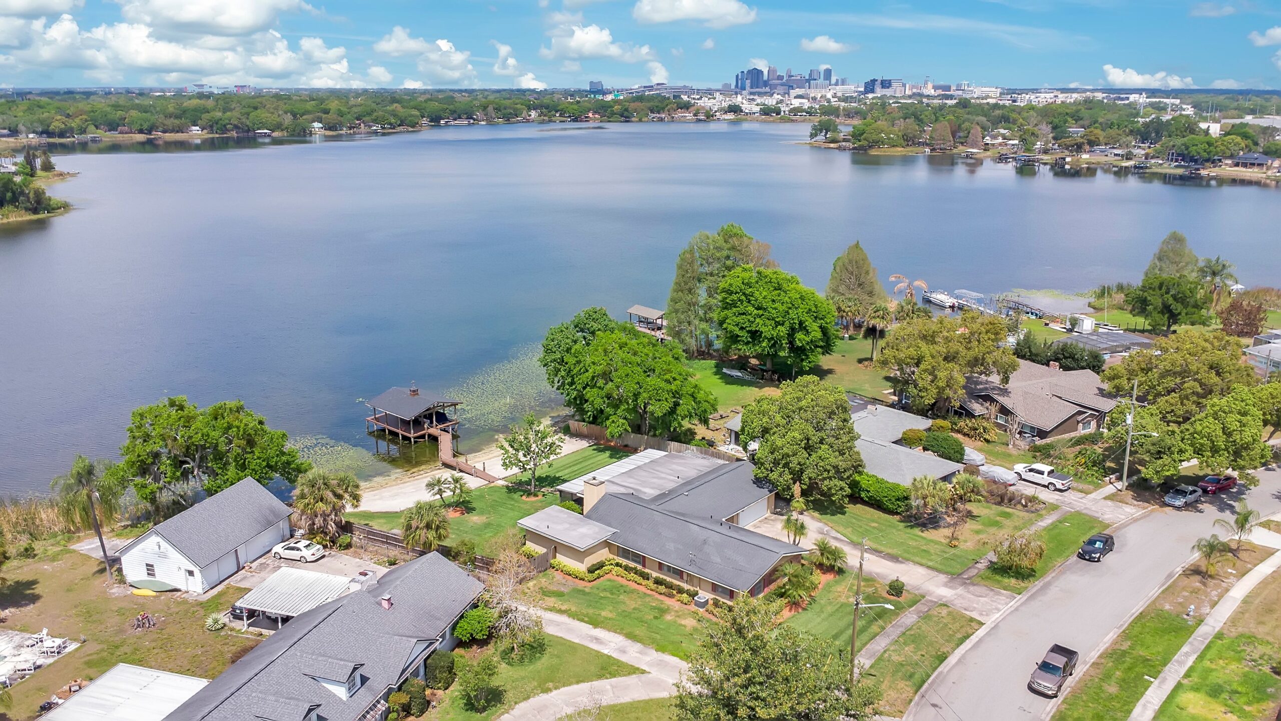Aerial view of Lake Holden in Orlando with the downtown Orlando skyline in the distance